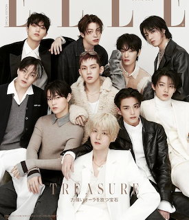 Studio portrait of ten members of the K-pop group Treasure in coordinated black, white, and beige outfits.