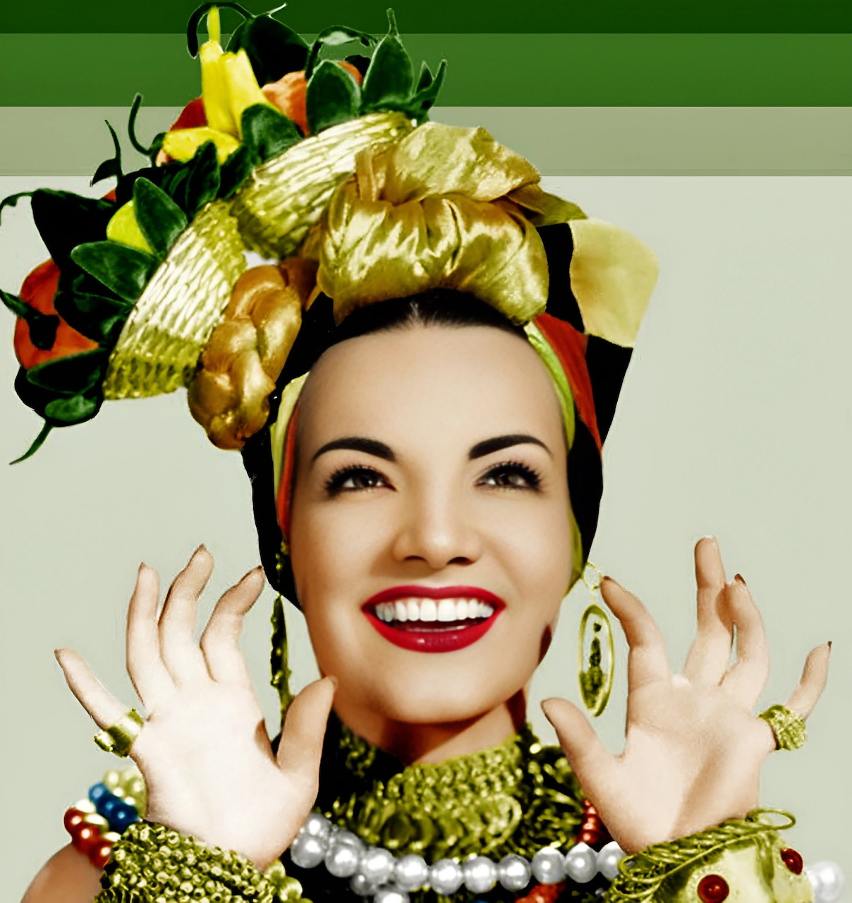 Stylized portrait of Carmen Miranda smiling in a fruit headdress with jewelry and raised hands