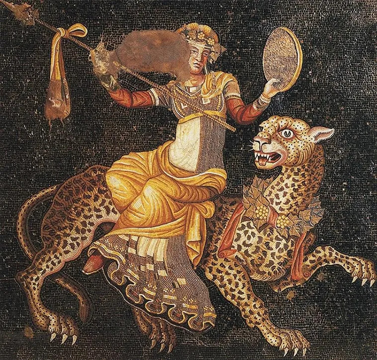 Ancient mosaic depicting figure on leopard with mirror and staff, intricate tile work in gold and earth tones