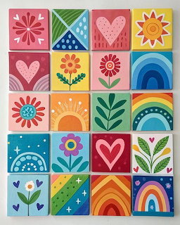 Grid of 20 colorful illustrated squares with hearts, flowers, rainbows, and geometric folk art patterns