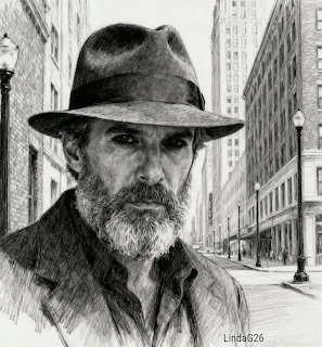 Black and white pencil drawing of a bearded man in a fedora hat with a city street background