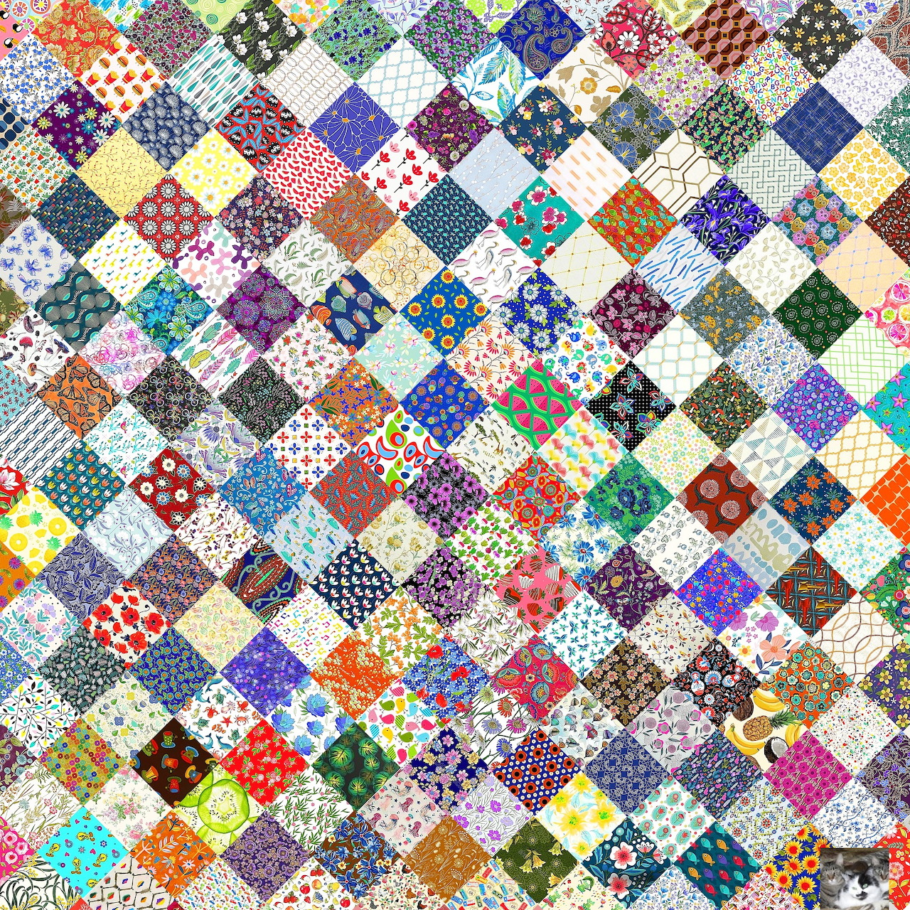 Colorful patchwork quilt with diamond-shaped fabric patches in various patterns and colors