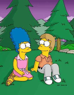 Marge and Homer Simpson sitting on grass outdoors with pine trees behind them