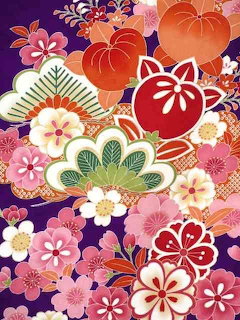 Colorful Japanese kimono fabric with pink, orange, and red floral patterns on purple background
