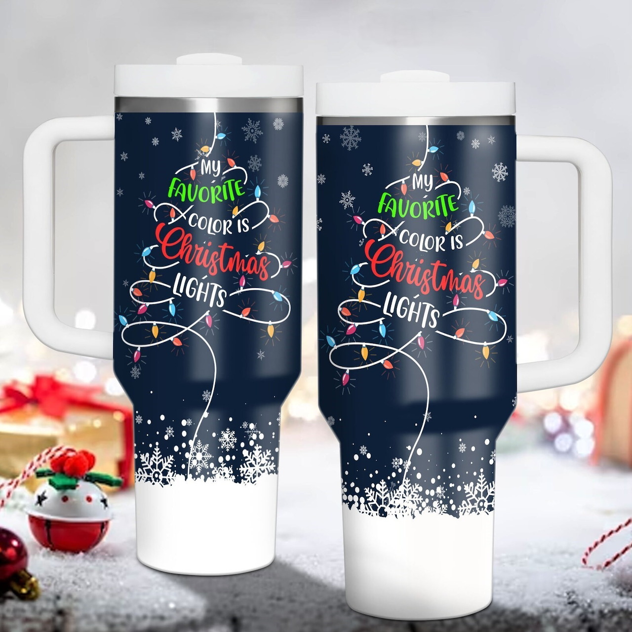 Two white tumblers with Christmas tree design and 'My Favorite Color is Christmas Lights' text on dark blue background