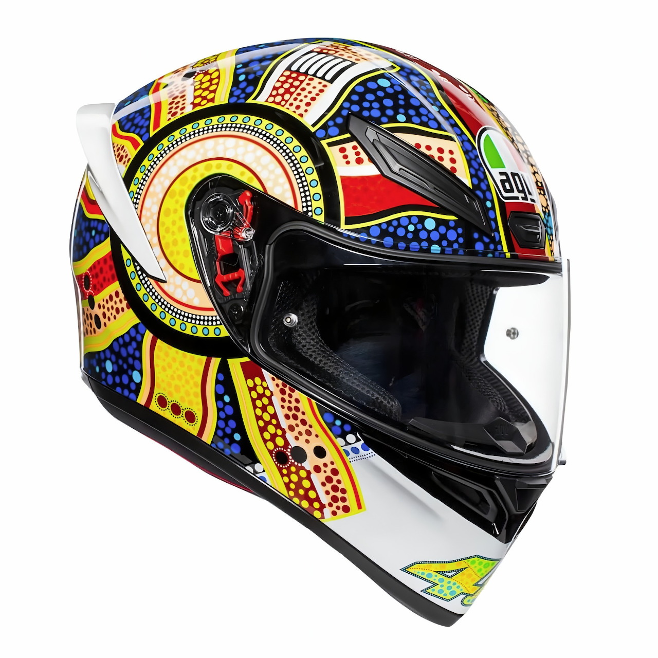 Colorful AGV motorcycle helmet with abstract tribal dot artwork in red, yellow, blue, and green on white background