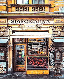 Ornate vintage pastry shop storefront with Slascicarna sign and decorative architectural details