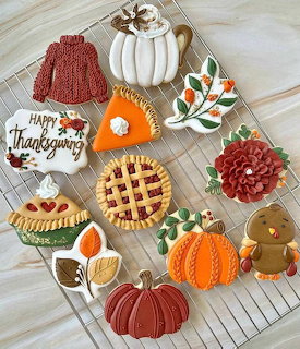 Colorful Thanksgiving cookies with fall designs on wire cooling rack