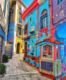Colorful painted buildings along a narrow Mediterranean street in Vietri sul Mare, Italy