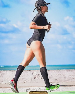 Woman Running on Beach