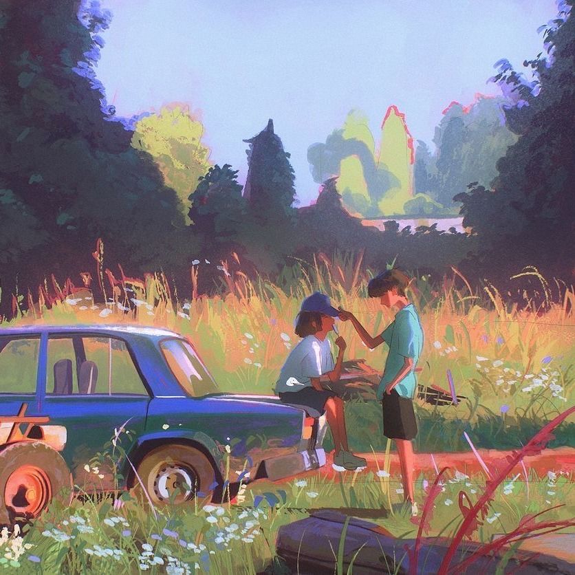 Couple standing by vintage blue truck at campsite near lake with mountains and wildflowers