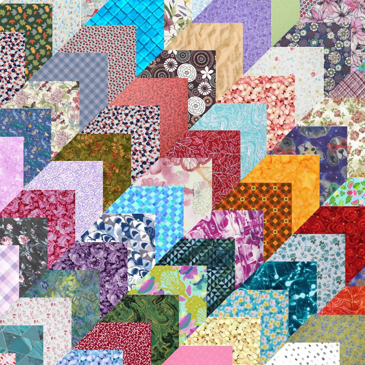 Colorful patchwork quilt with geometric fabric pieces in chevron pattern with florals, dots, and various prints