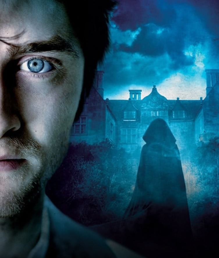 Movie poster showing man's face and mysterious figure before mansion