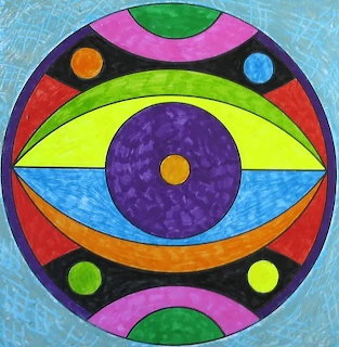 Colorful circular mandala with geometric eye pattern and concentric rings in vivid hues