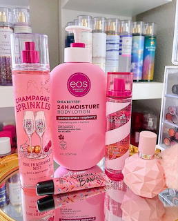 Pink beauty and skincare products displayed on white vanity surface