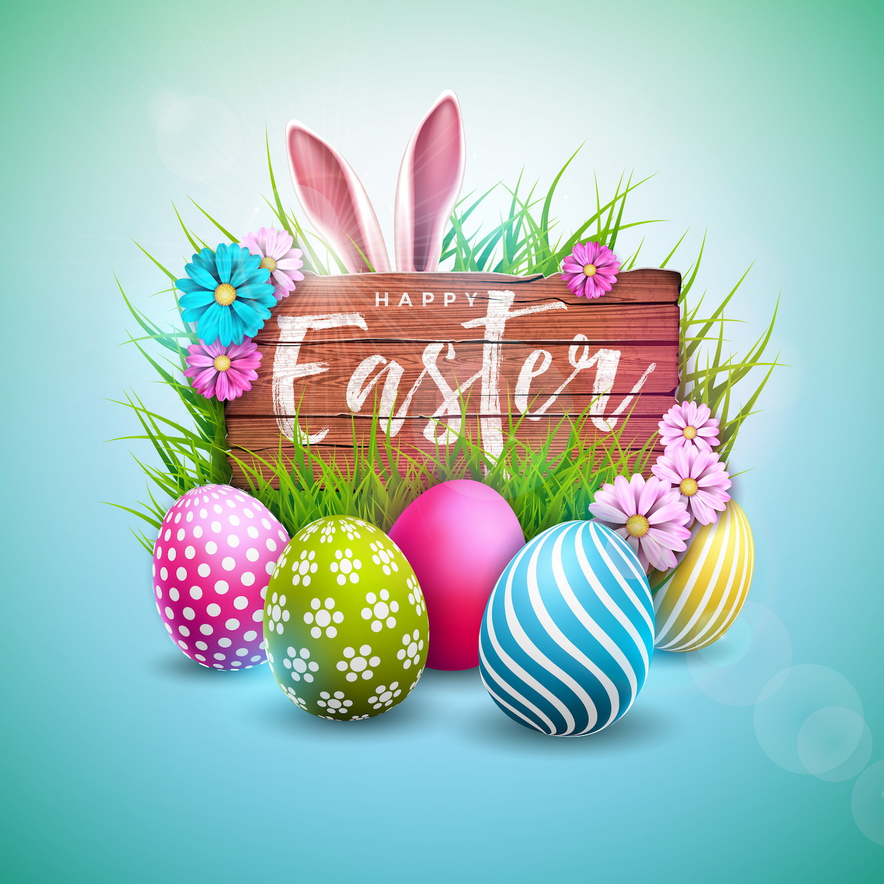 Decorated Easter eggs with pink bunny ears, spring flowers and grass on blue background