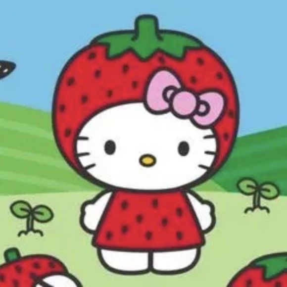 Hello Kitty in strawberry costume standing in garden with strawberries