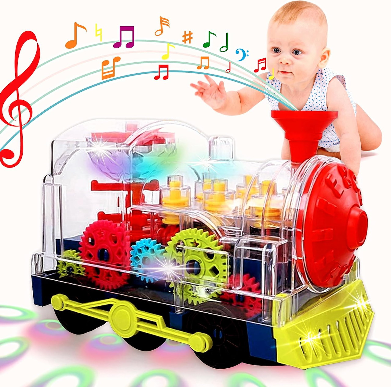 Baby beside a colorful transparent toy train with gears and musical notes