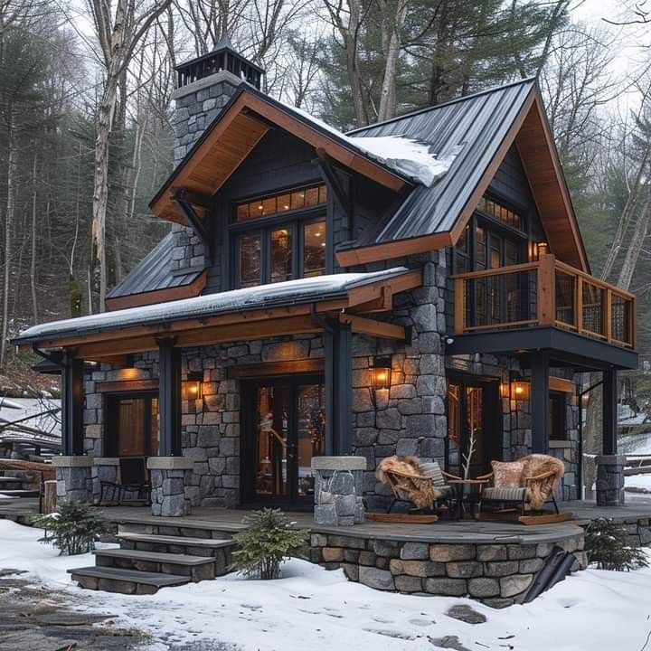 Rustic stone and wood cabin with glowing lights in a snowy forest