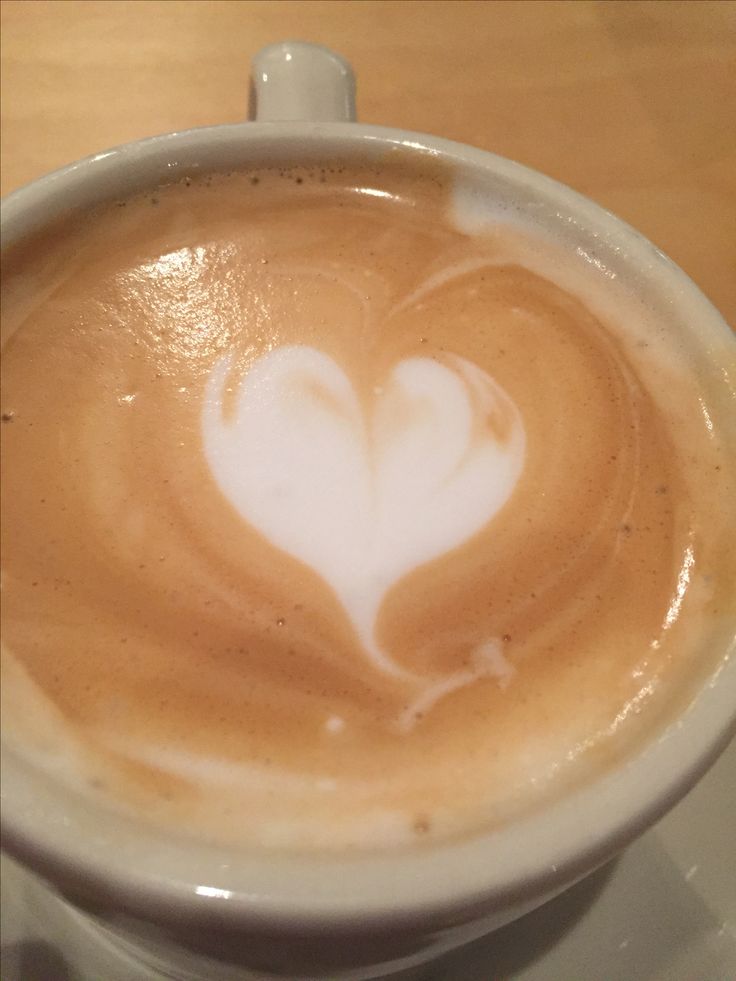 White heart latte art in coffee cup