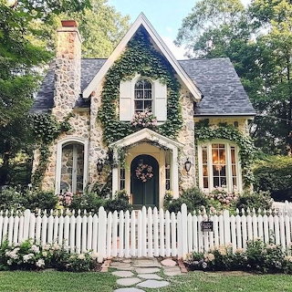 Charming Stone Cottage with White Picket Fence