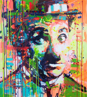 Colorful pop art portrait of Charlie Chaplin with paint drips and neon splatter effects