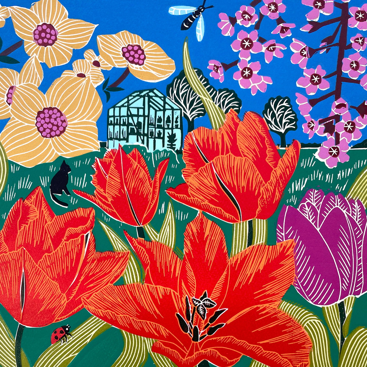 Colorful linocut print of red tulips, daffodils, pink flowers and Tudor house with bold patterns