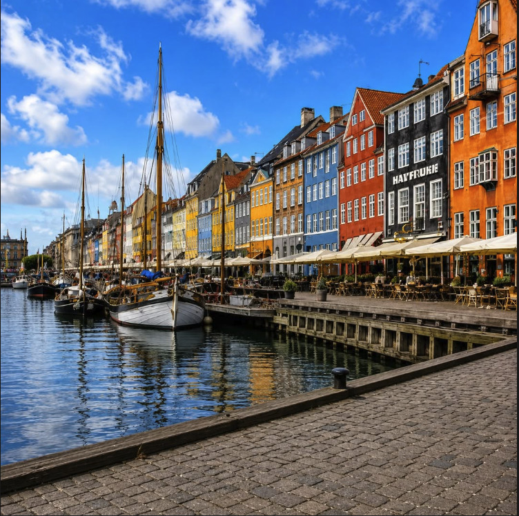 Colorful buildings and sailboats along the Nyhavn canal in Copenhagen