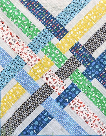 Colorful patchwork quilt with diagonal patterned fabric strips