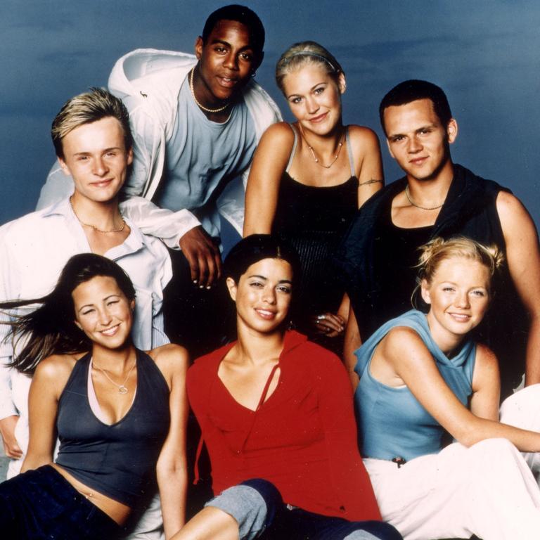 S Club 7 band members posing together in a promotional photo