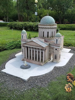 Miniature scale model of Esztergom Basilica with dome and columns on white base in a park