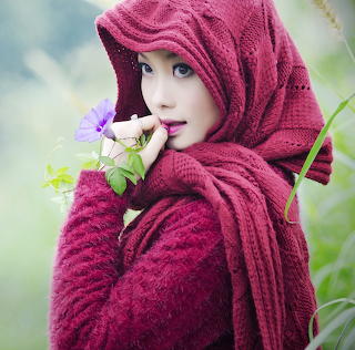 Woman in Burgundy Headscarf with Flowers