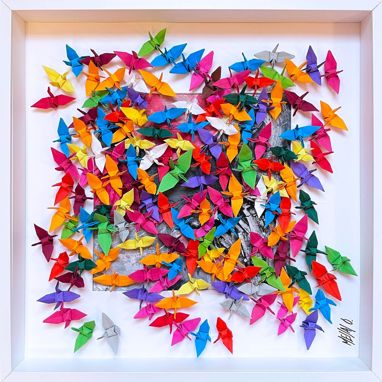 Cluster of colorful origami paper butterflies in rainbow colors on white background