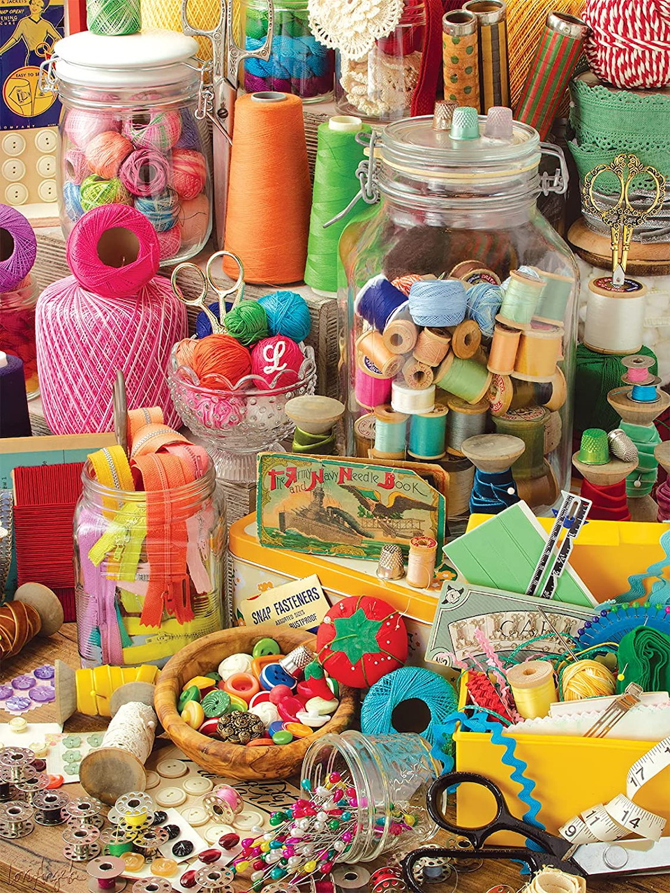 Assorted sewing supplies with colorful thread spools, buttons, fabrics, and crafting tools displayed together