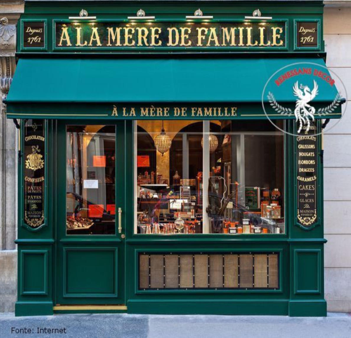 Green and gold Parisian storefront of À la Mère de Famille shop with ornate traditional architecture