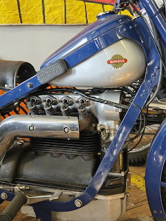 Vintage Nimbus motorcycle with blue frame and exposed four-cylinder engine
