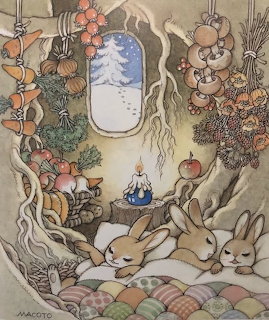 Illustration of three rabbits sleeping under a patchwork quilt in a burow with autumn decorations and snowy window