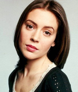 Young brunette woman with bob haircut and dark cardigan, close-up portrait