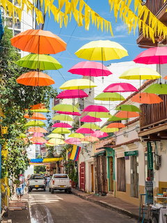 Colorful Umbrellas Over Street