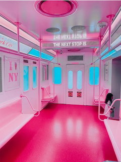 Surreal empty train interior in pink and cyan neon lighting