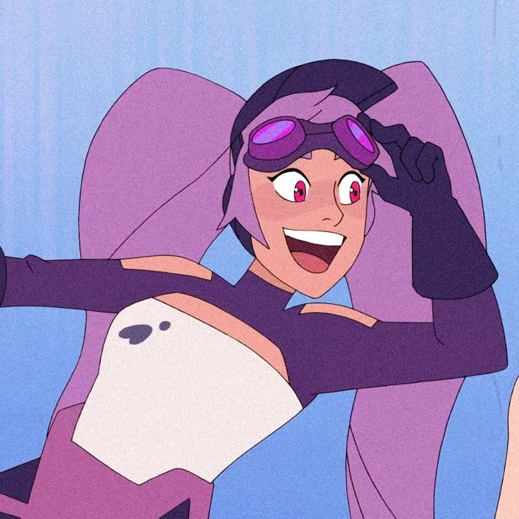 Entrapta smiling and posing with goggles on her head in a cartoon scene