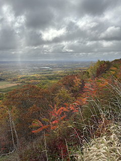 Autumn landscape overlooking Annapolis Valley with fall foliage and cloudy sky