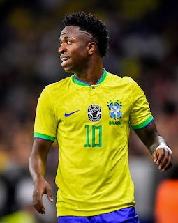 Soccer player Vinicius Junior wearing Brazil's yellow jersey on the field