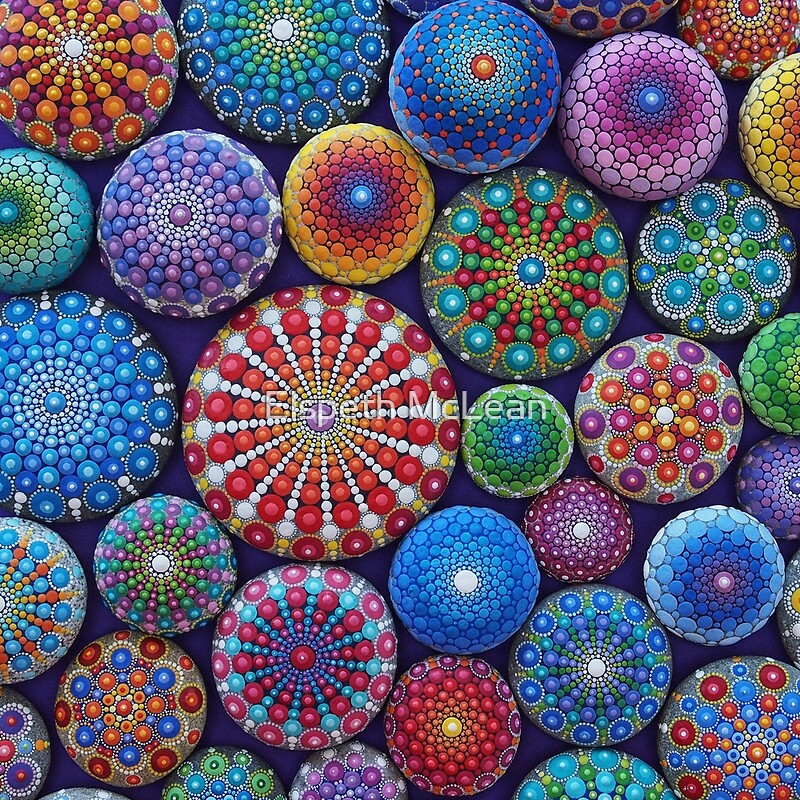 Collection of colorful painted stones with intricate mandala dot art patterns in various sizes