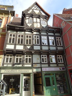 Historic half-timbered house with black and white wooden framework in Quedlinburg, Germany