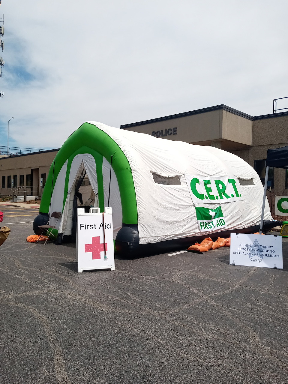 Inflatable CERT emergency tent set up outside a building on pavement