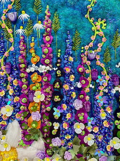 Dense garden of colorful lupine flowers and mixed blooms in vertical arrangement