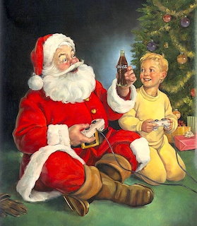 Santa Claus in red suit sitting with blonde child next to Christmas tree with toys
