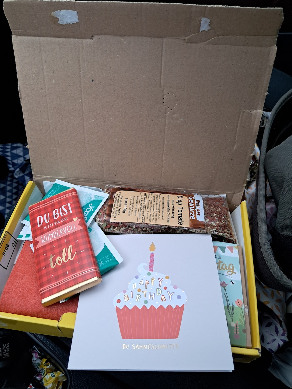 Assortment of gift package items laid out together