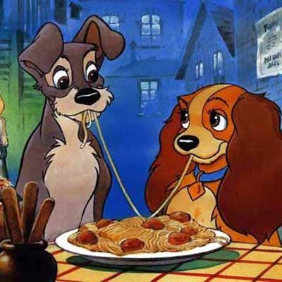 Lady and the Tramp cartoon dogs sharing spaghetti at a table in a night scene